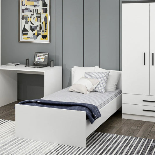 Modern bedroom with a bed, desk, and wardrobe.