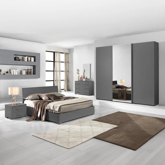 Modern bedroom with gray furniture, including a bed, dressers, and wardrobes.