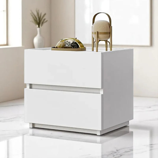 White nightstand with two drawers in a modern room setting