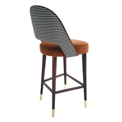 Bar stool with houndstooth backrest and brown seat on a white background