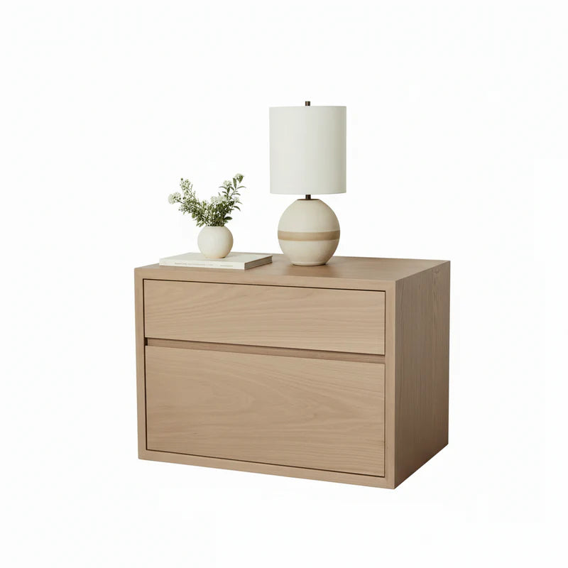 Wooden nightstand with a lamp and plant on a white background