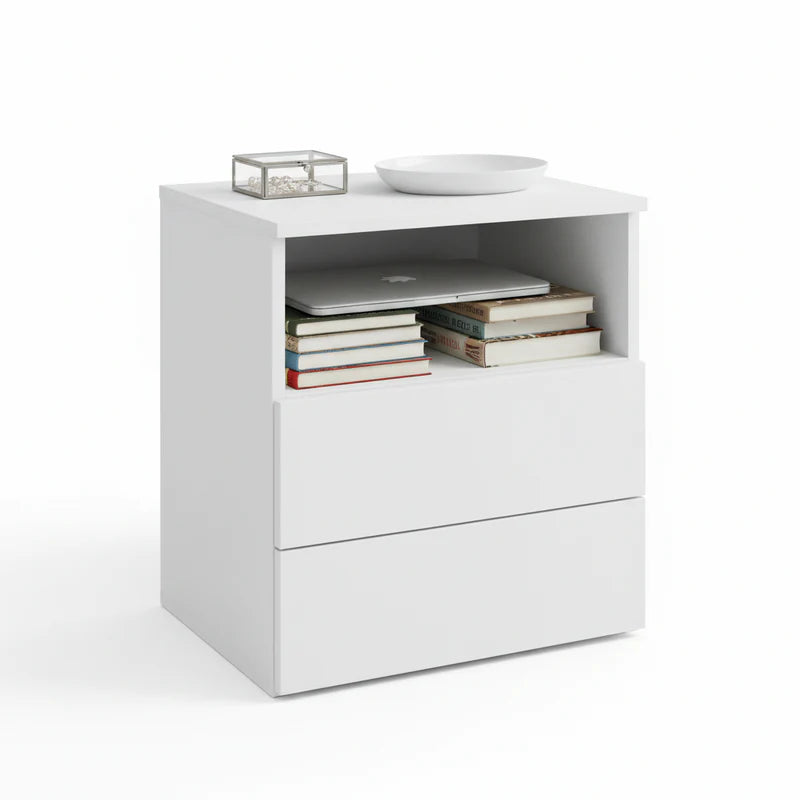White nightstand with books, a laptop, and a bowl on top