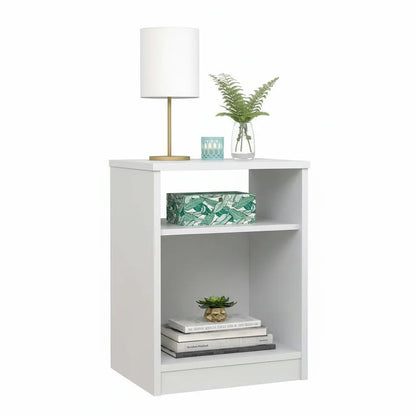 White bookshelf with decorative items on a white background