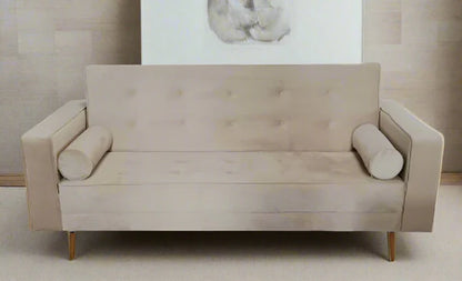 Beige sofa with cylindrical armrests in a minimalistic room.