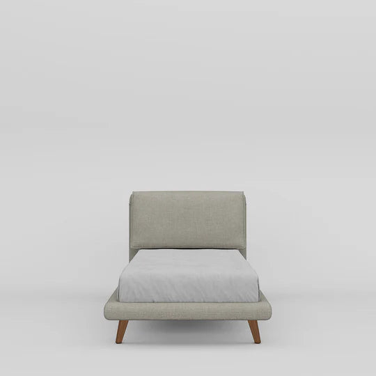 Gray upholstered chair with a white cushion on a light gray background