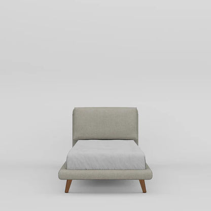 Gray upholstered chair with a white cushion on a light gray background