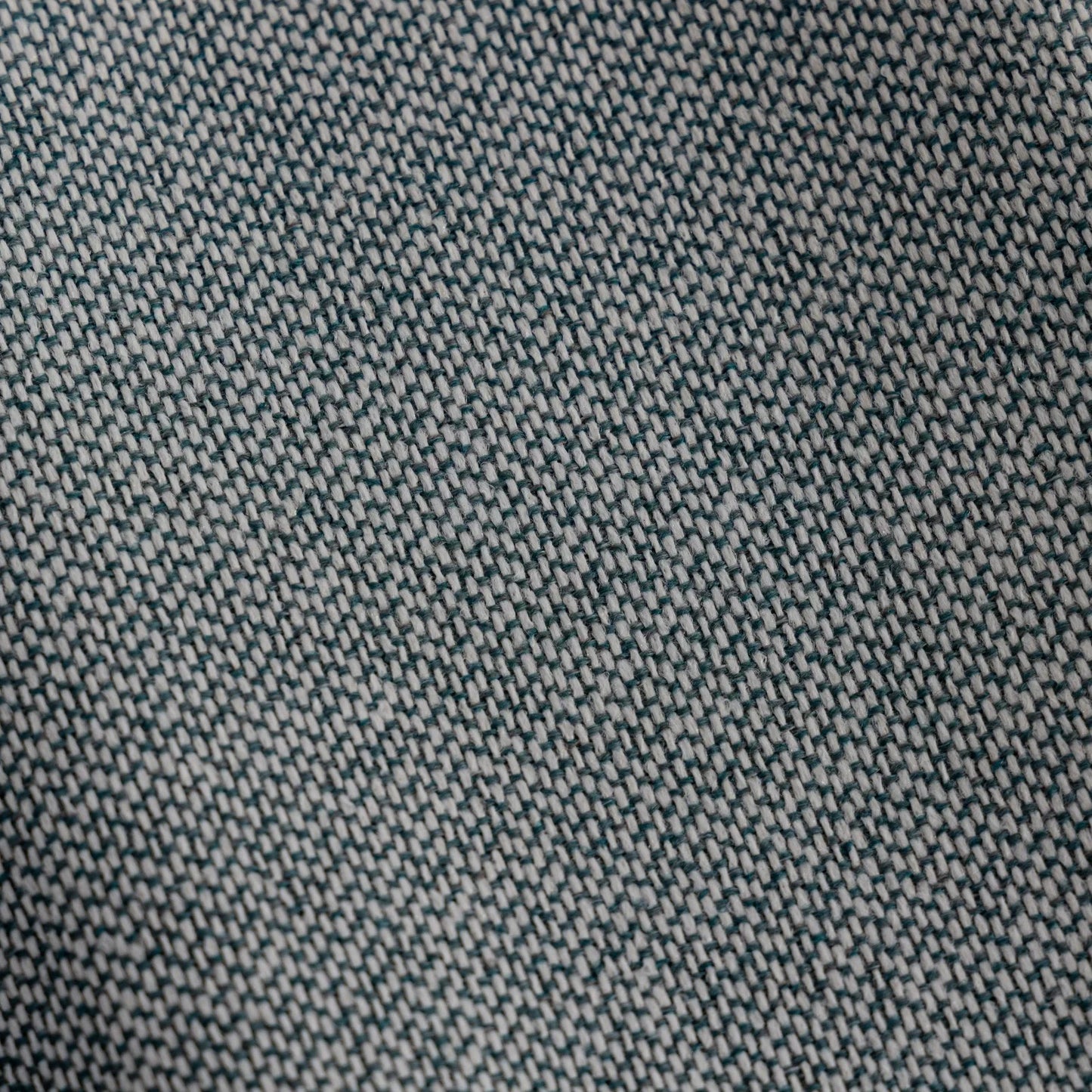Close-up of a textured teal fabric pattern