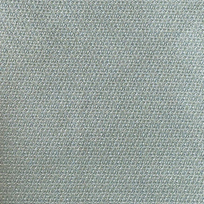 Close-up of a textured light blue fabric surface