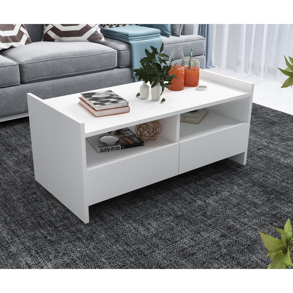 White coffee table with decorative items in a living room setting