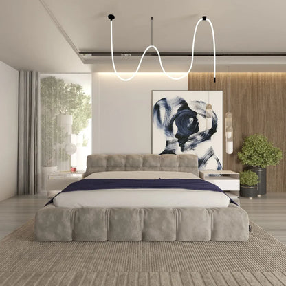 Modern bedroom with a bed, abstract art, and decorative elements.