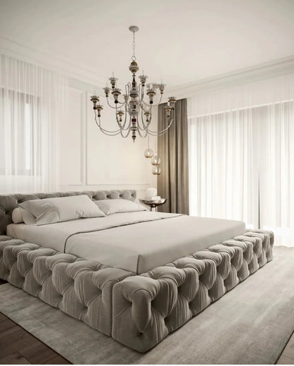 Luxurious bedroom with a tufted bed and chandelier