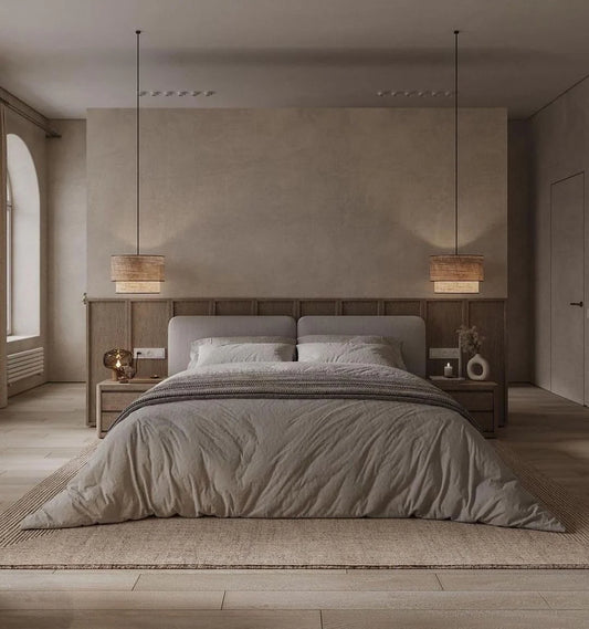 Modern bedroom with a large bed, wooden headboard, and minimal decor.
