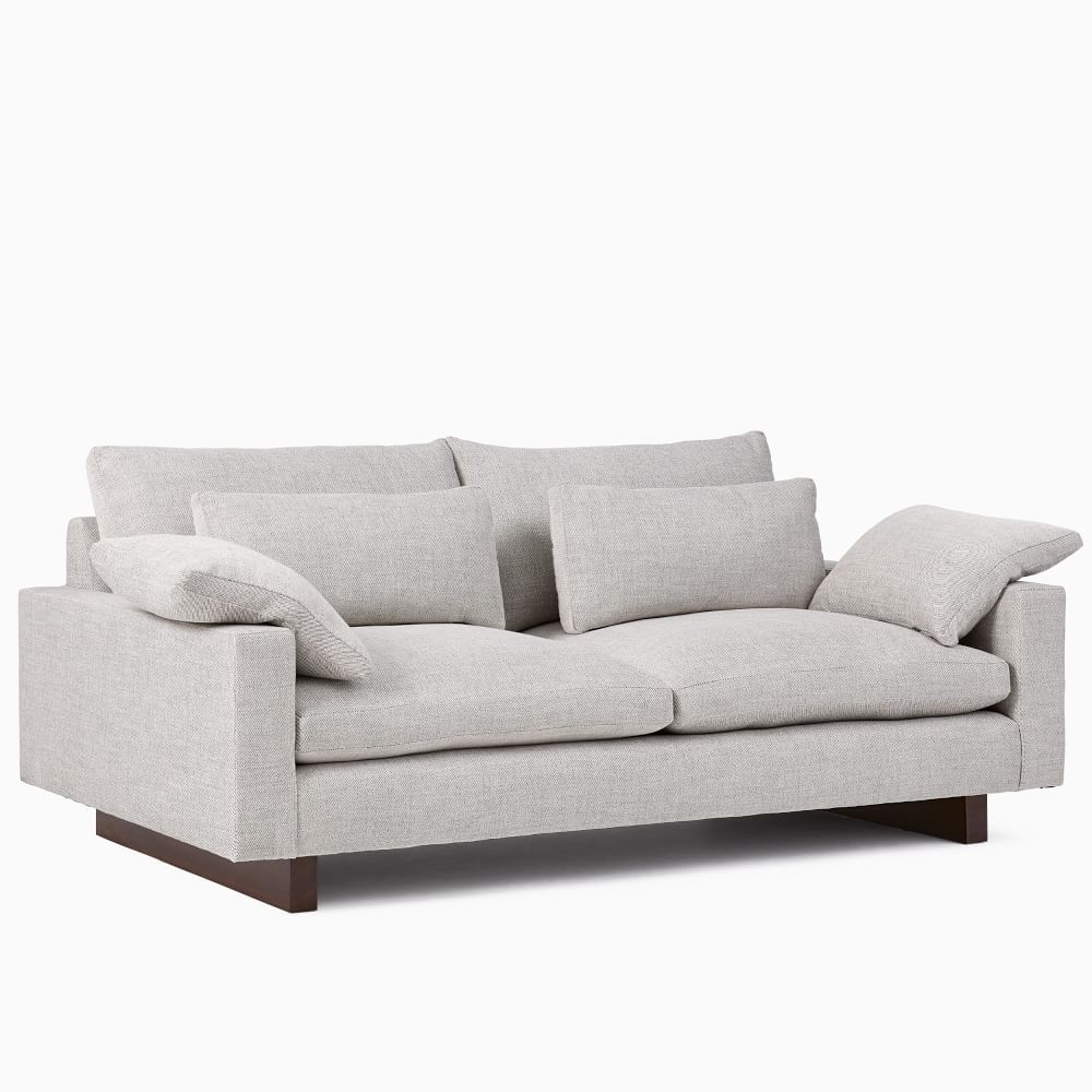 Gray sofa with cushions on a white background