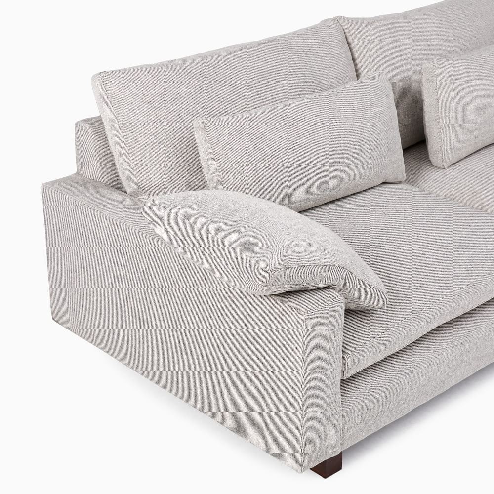 Gray sofa with cushions on a white background