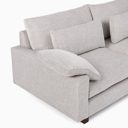 Gray sofa with cushions on a white background