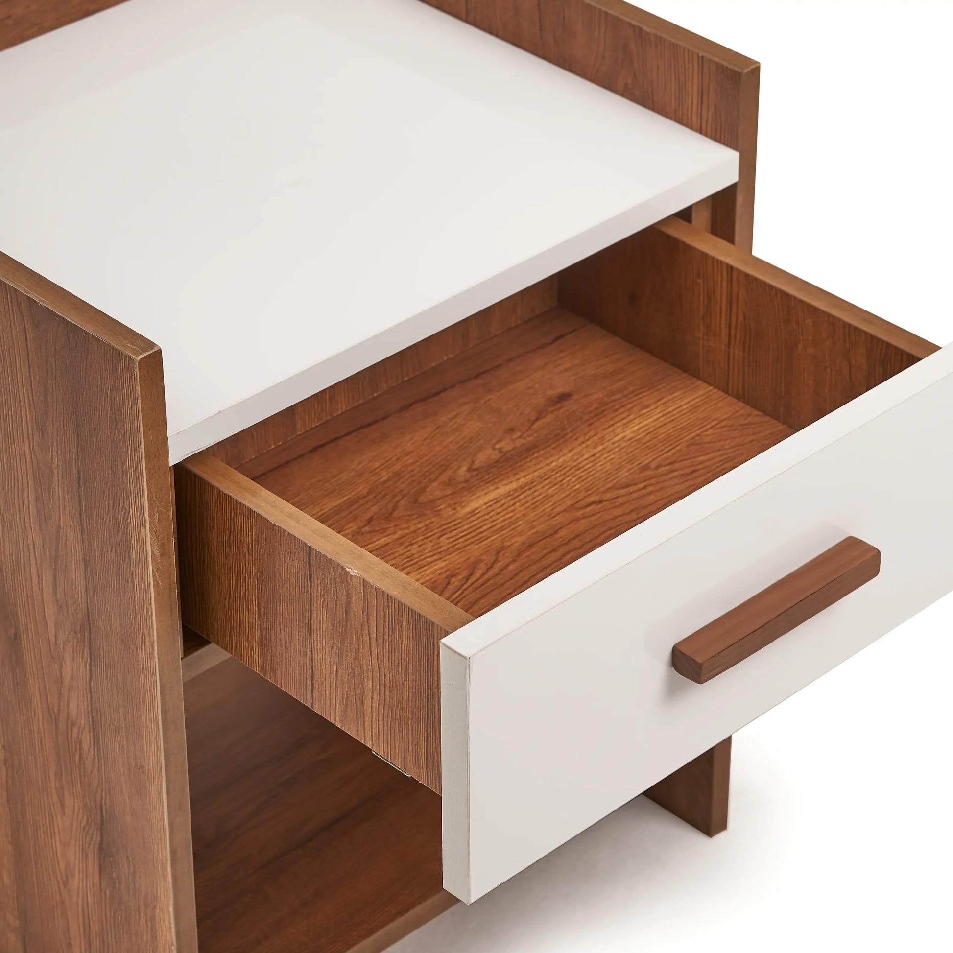 Wooden desk with an open drawer on a white background