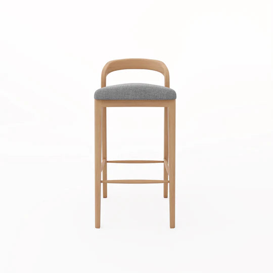 Bar stool with wooden frame and gray cushioned seat on a white background