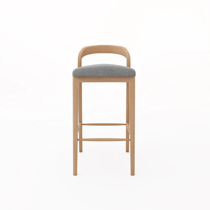Bar stool with wooden frame and gray cushioned seat on a white background