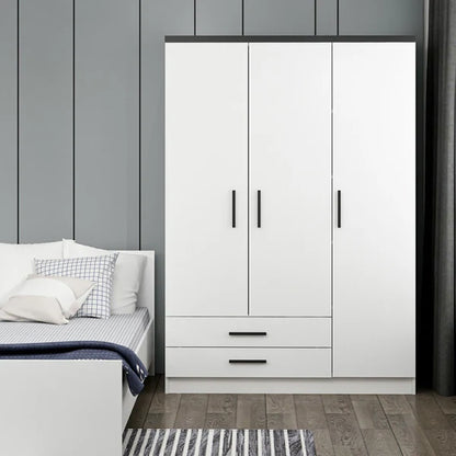 White wardrobe with black handles in a bedroom setting