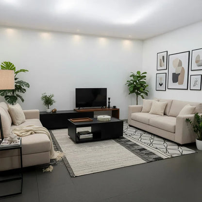 Modern living room with beige sofas, a TV stand, and decorative elements.