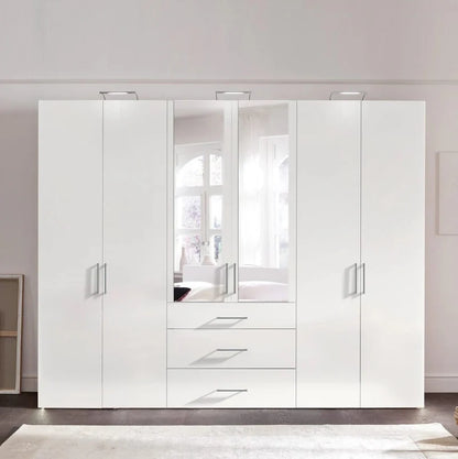 White wardrobe with mirror doors in a room setting