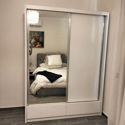 White wardrobe with sliding mirror door in a bedroom setting