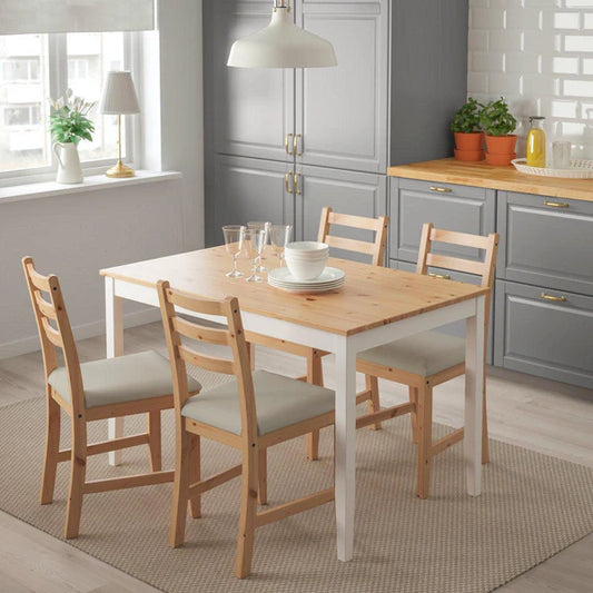 Dining room with a wooden table and chairs in a kitchen setting.