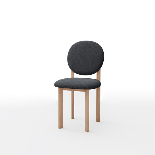 Chair with dark gray upholstered seat and backrest on a white background