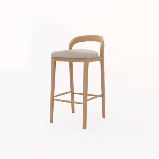 Wooden bar stool with beige cushion on a white background