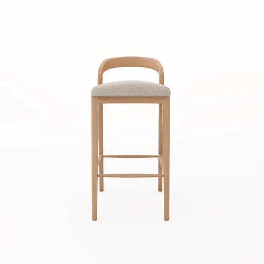 Wooden bar stool with a cushioned seat on a white background
